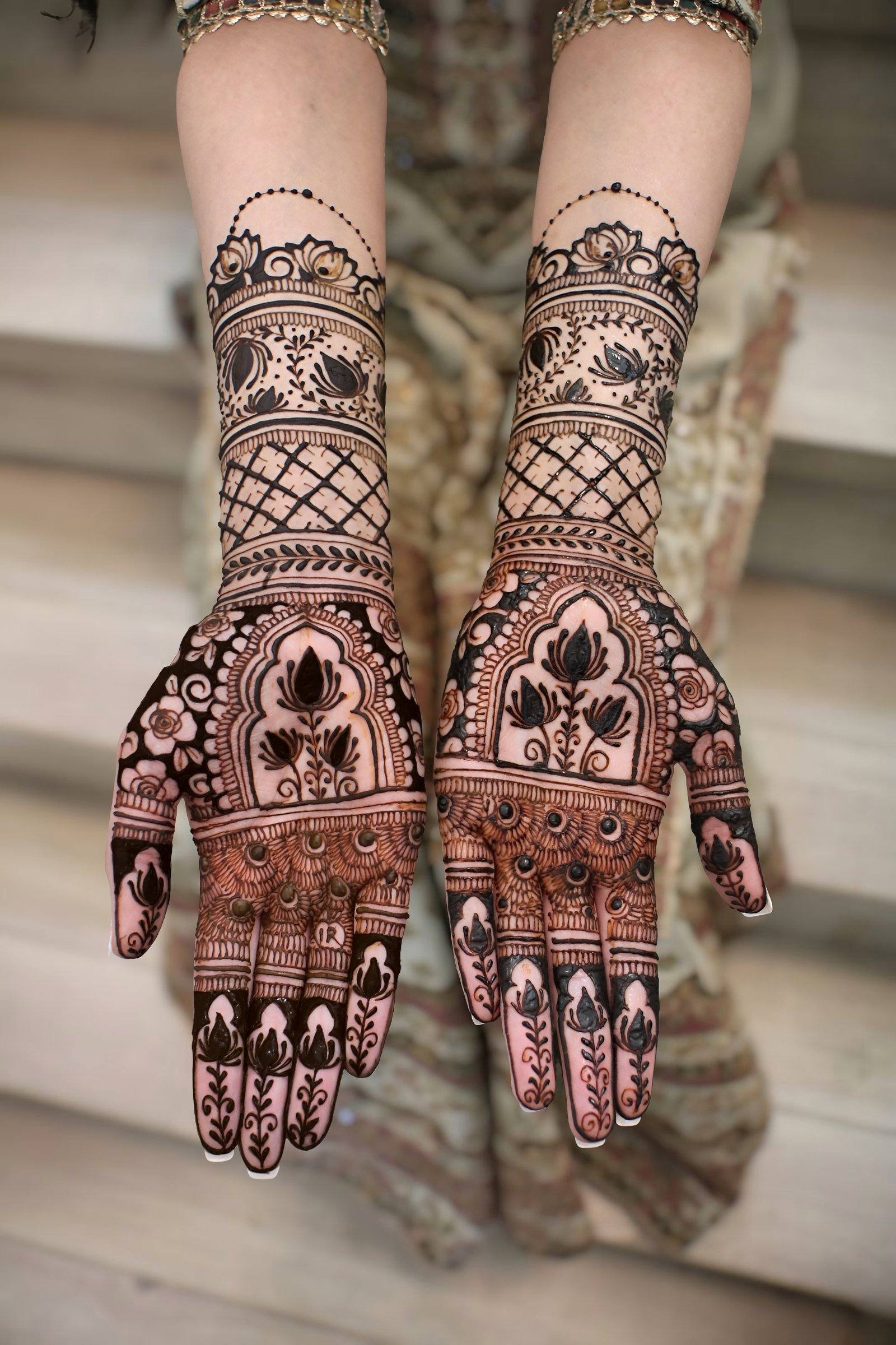 Bold bridal henna palms with lattice and floral bands