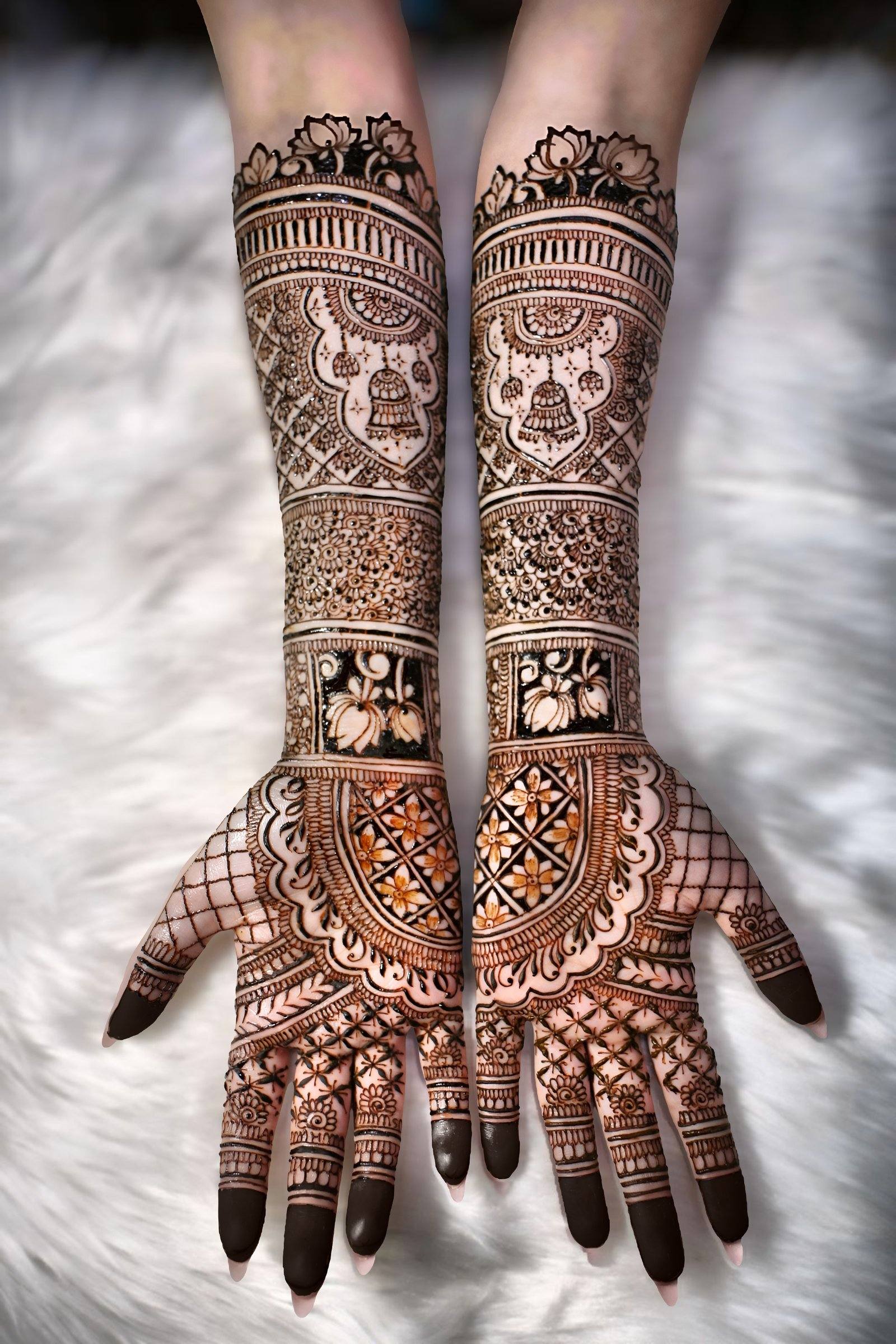 Detailed full-arm bridal henna with figurative panels on white fur