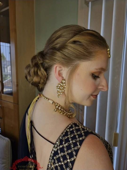 Twisted updo with soft face-framing curls